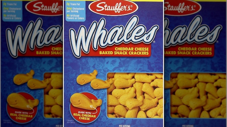 A pack of Stauffer's Whales Baked Cheese Crackers with a cartoon of an orange whale surfing