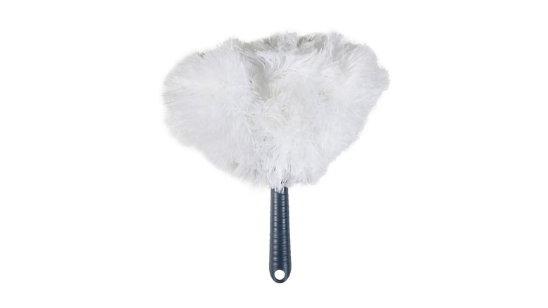 A white feather-style duster with a black handle