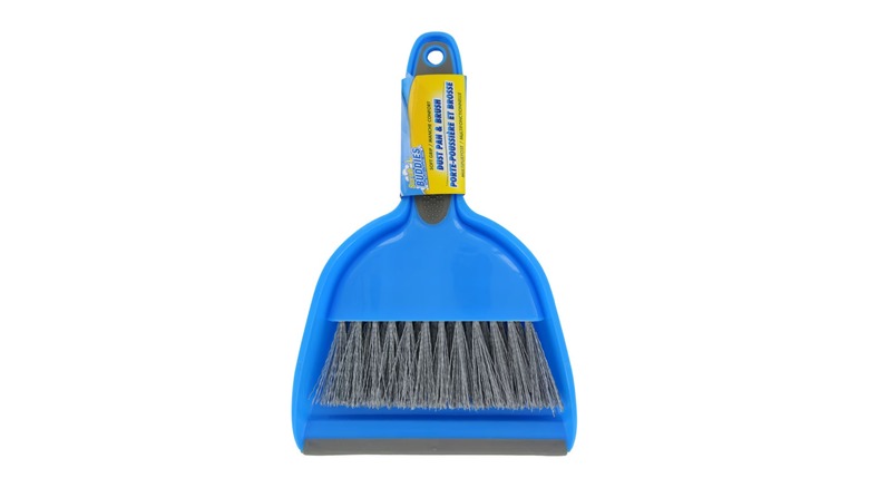 A blue hand broom and dustpan set.
