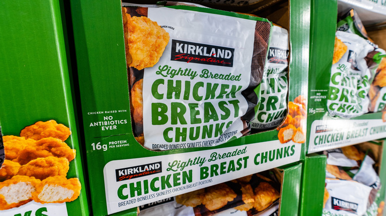 Four-pound bags of Kirkland chicken breast chunks in display