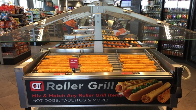 a view of a large roller grill on the interior of a Quick Trip