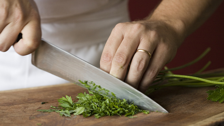 Knife chopping parsley