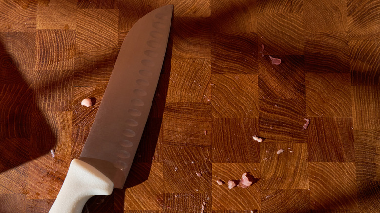 A knife on a butcher's board