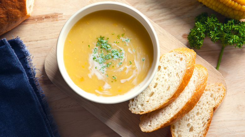 Corn soup with slices of country bread