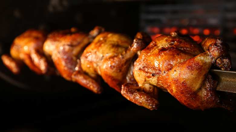 Chickens in rotisserie oven