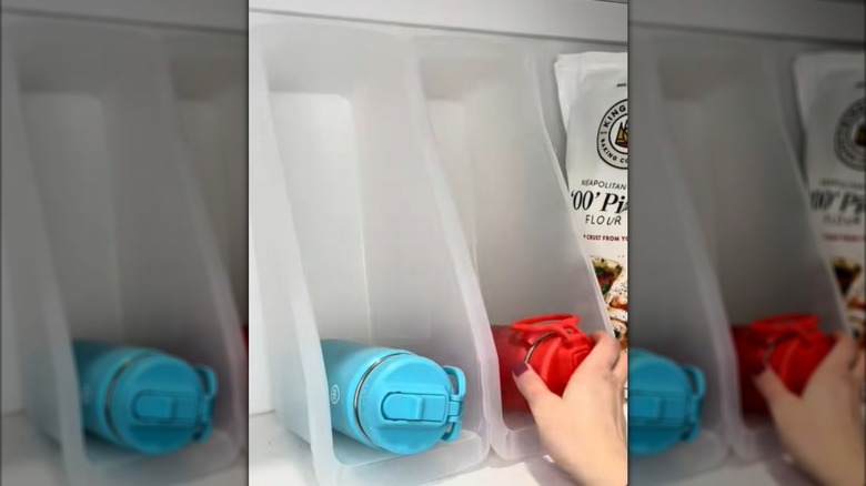 Water bottle storage in book bins