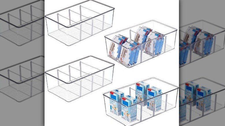Four clear food compartment organizers on white background.