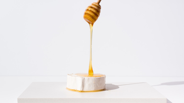 honey poured on goat cheese