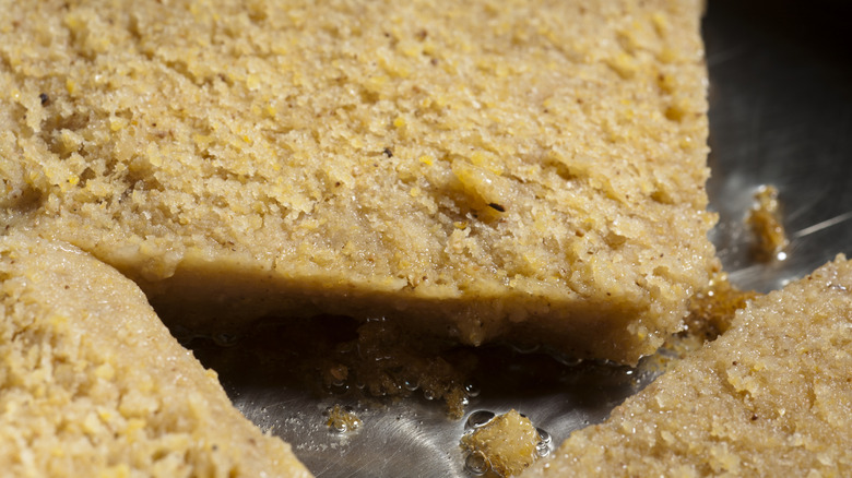 Cornmeal mush, sliced and fried