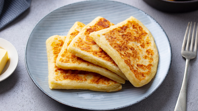 Potato scones on a plate, cut into quarters