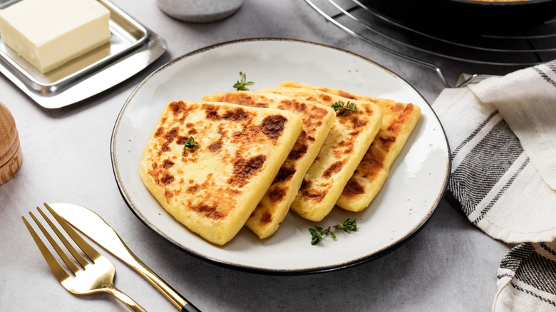 A plate of potato scones, cut into quarters