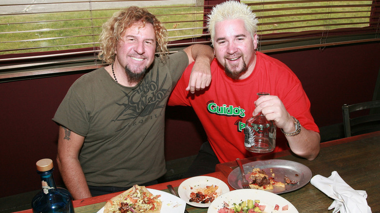 Sammy Hagar and Guy Fieri at a table