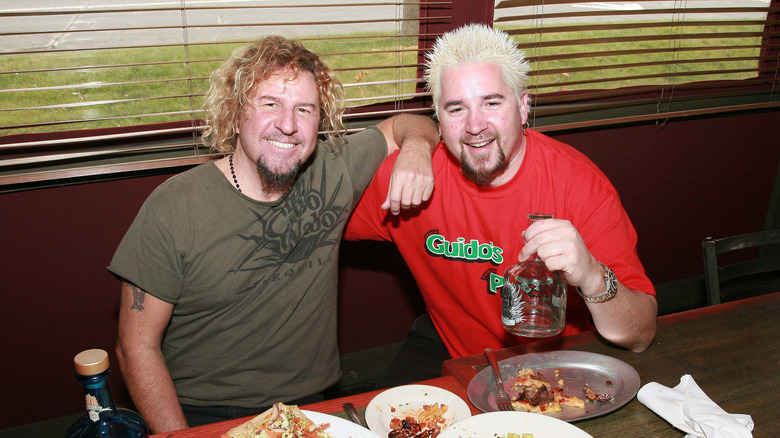 Guy Fieri eating with friend