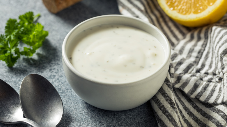 Ranch dressing in a bowl with spoons