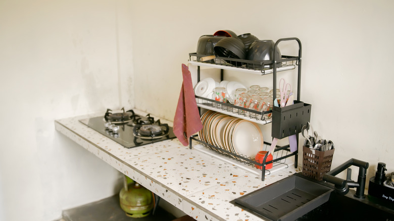Kitchen counter with cluttered dish rack