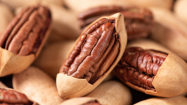 Pecans half out of shells