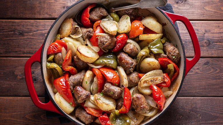 sausage, peppers, and onions in a dutch oven