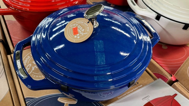 A blue Lodge Dutch oven in a store display