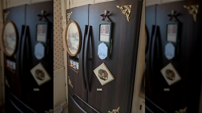 Fridge upcycled with woodgrain contact paper, framed pictures, and brass trims