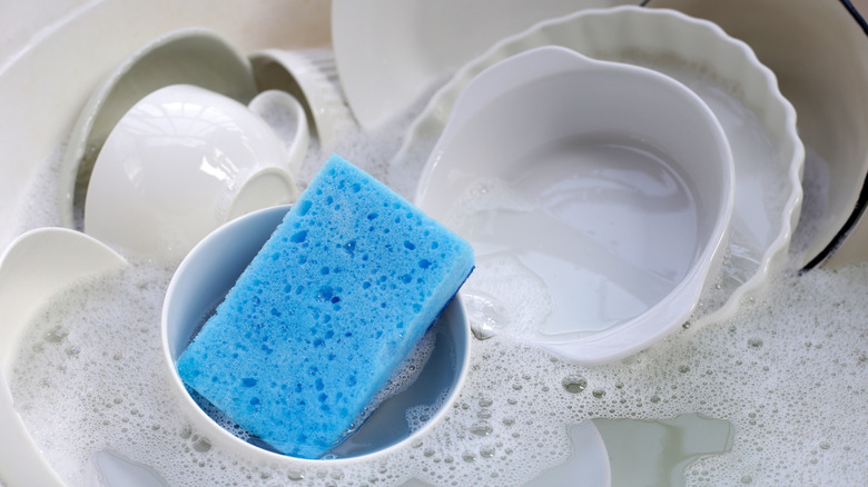 Washing dirty cups and plates