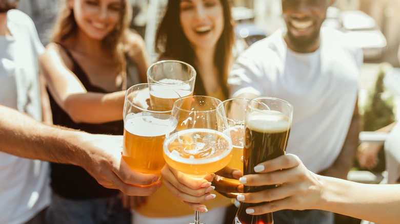 Friends cheer beers