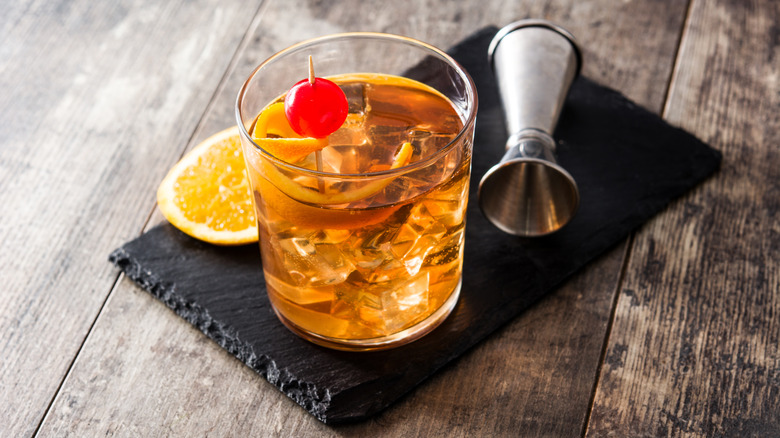 Old fashioned cocktail with cherry