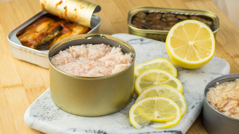 canned crab meat next to lemons