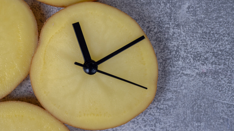 Round potato slice turned into a clock