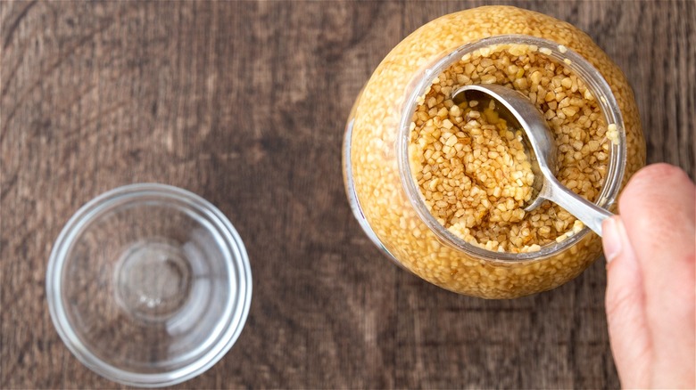 Spoon in jarred minced garlic