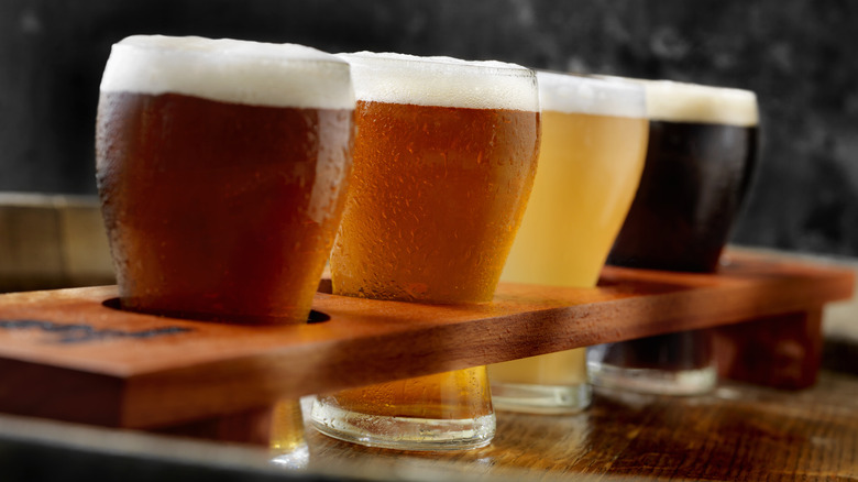 A flight of beer in four different colors