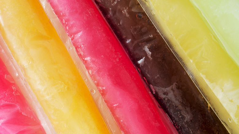 Close up of different colored popsicles