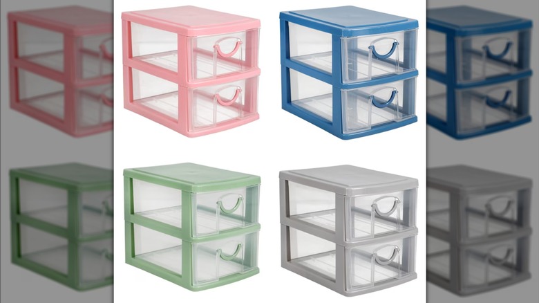 Four sets of two plastic 2-tier drawers in pink, blue, green, and gray