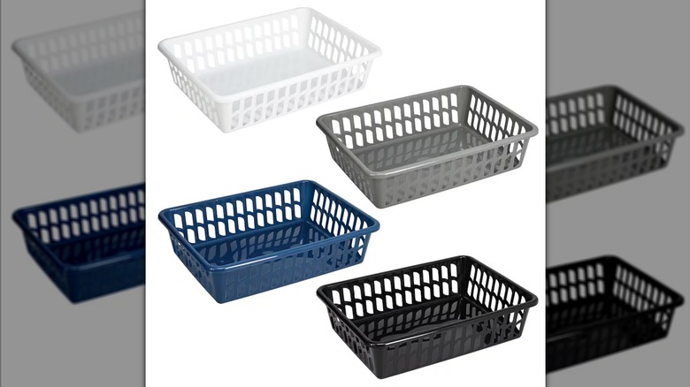 4 Rectangular Slotted Plastic Baskets, in white, gray, blue, and black