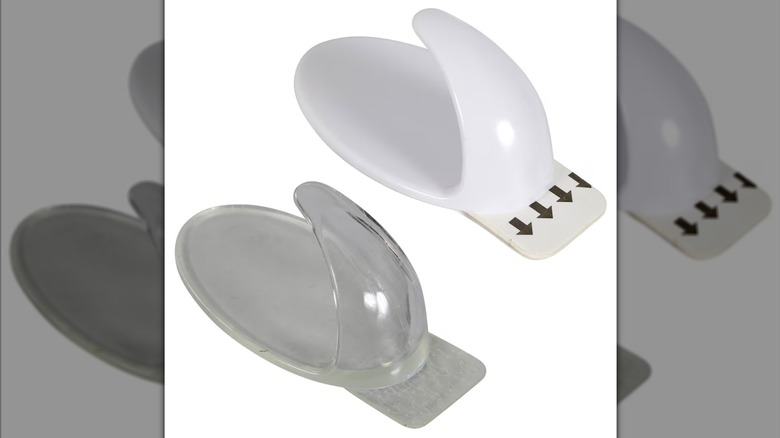 Two plastic removable wall hooks with adhesive backing