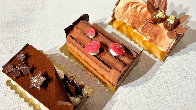 Three designed pastries with toppings