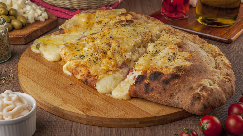Calzone served on wooden dish