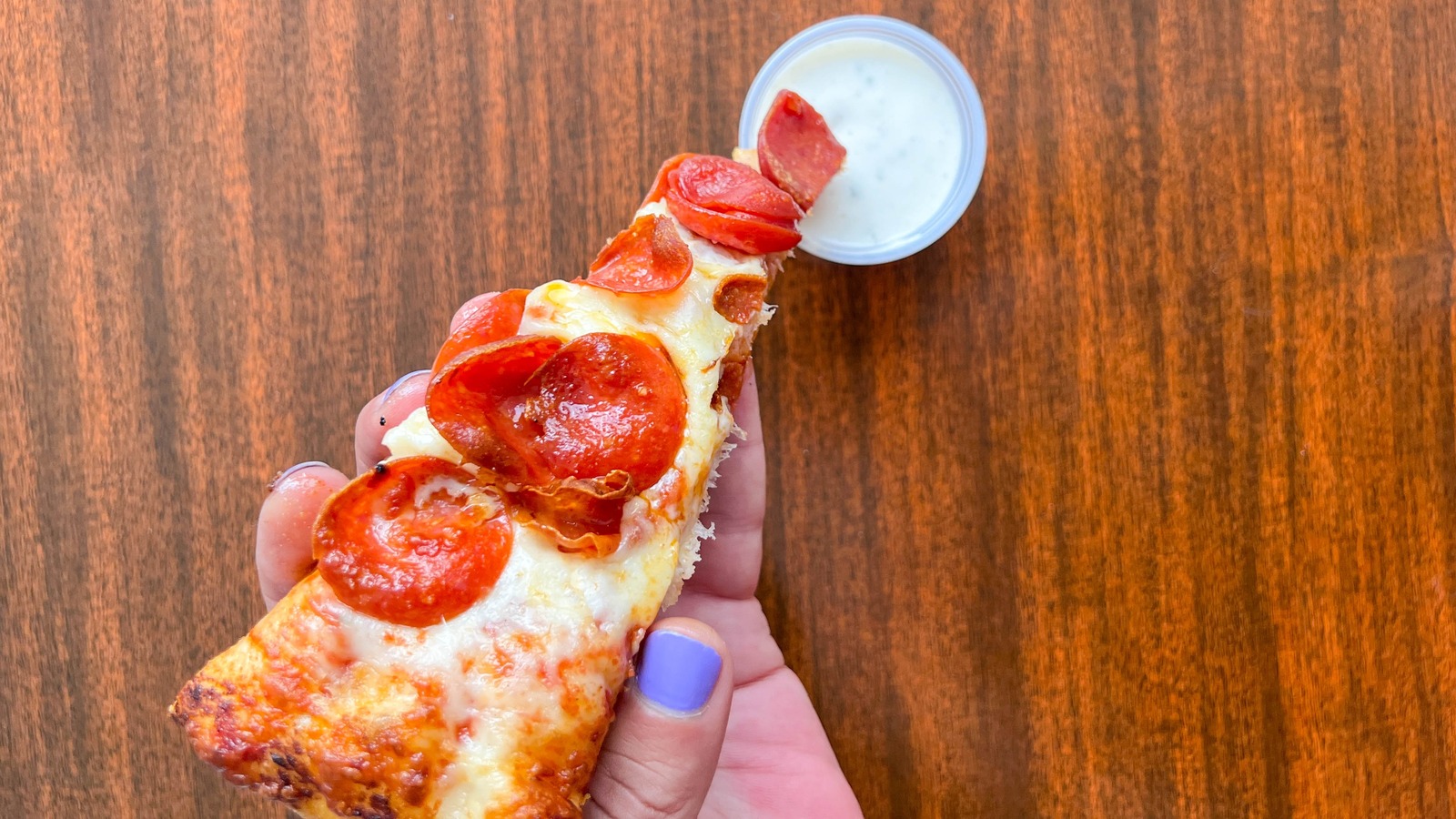 Domino's Might Be Responsible For Why You Dip Your Pizza Slices In Ranch