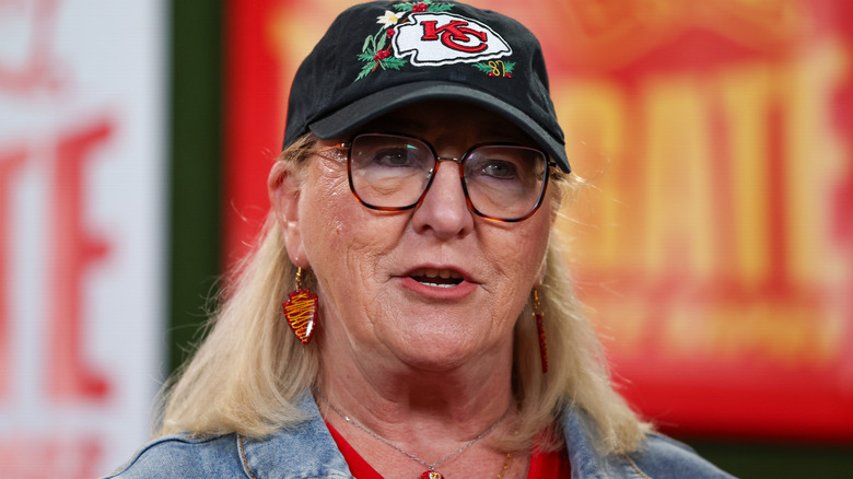 Donna Kelce, mother of NFL players Jason and Travis Kelce, speaking while wearing a black Kansas City Chiefs hat
