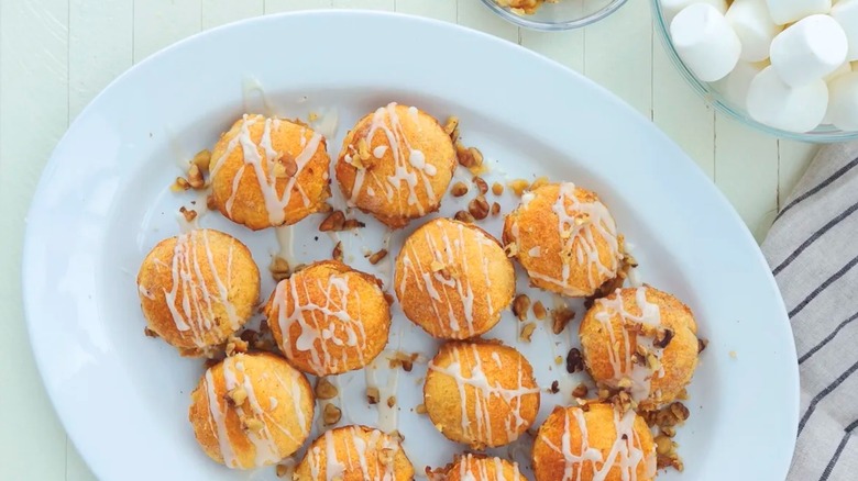 A plate of Magic Marshmallow Crescent Puffs, also known as the Mama Kelce dinner rolls, on a white plate