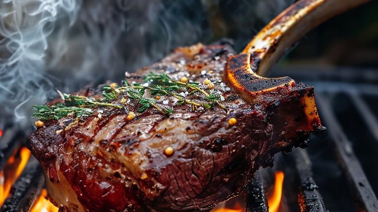 Steak hitting the grill at high heat