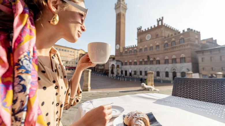 Woman having breakfast in Italy 