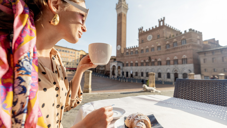 Woman having breakfast in Italy