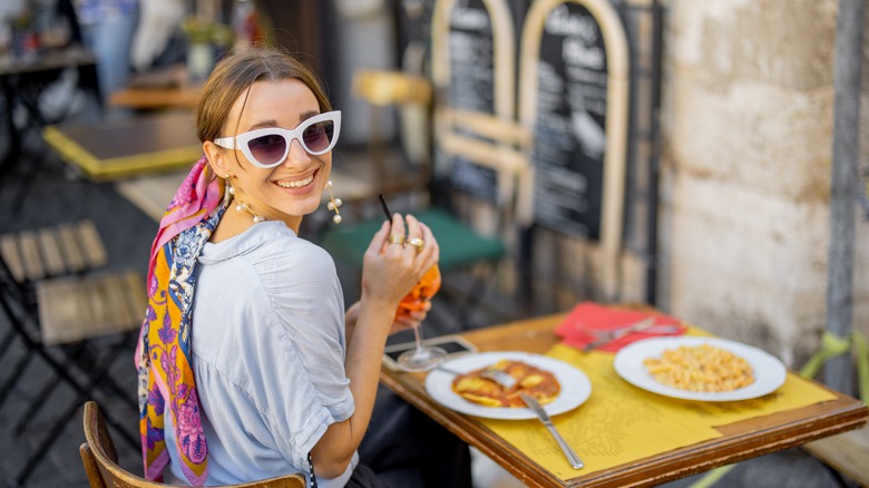 Young woman eating at an Italian restaurant 