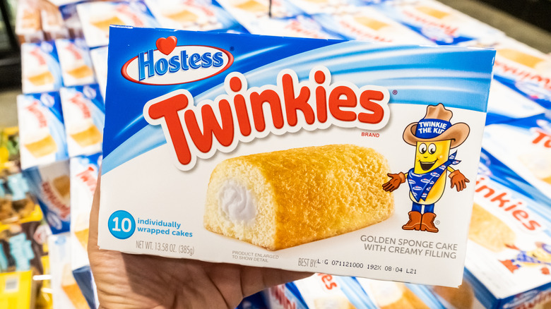 person holding box of Twinkies