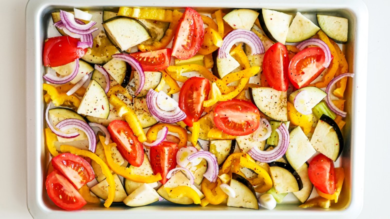 https://www.thedailymeal.com/img/gallery/dont-throw-away-charred-baking-sheets-use-them-to-brown-veggies-instead/browning-veggies-on-your-baking-sheet-1677883356.jpg