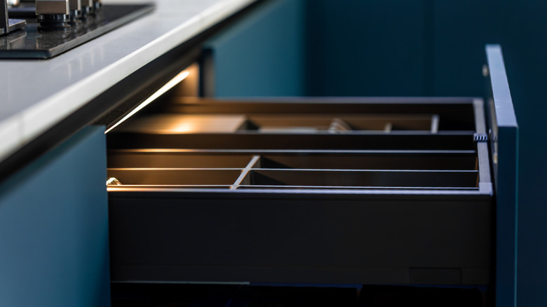 An open kitchen drawer