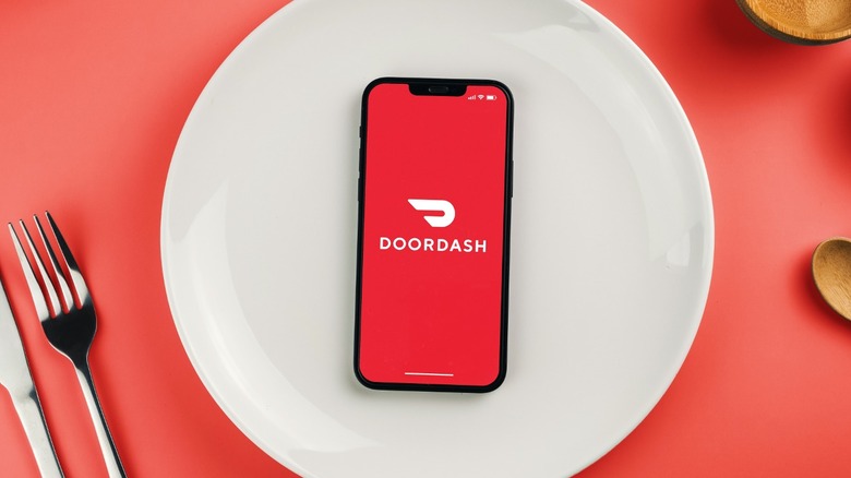 phone open to DoorDash on plate