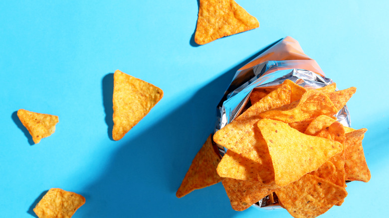 open bag of Doritos nacho cheese chips