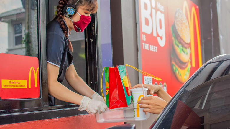 Drive-thru employee and customer