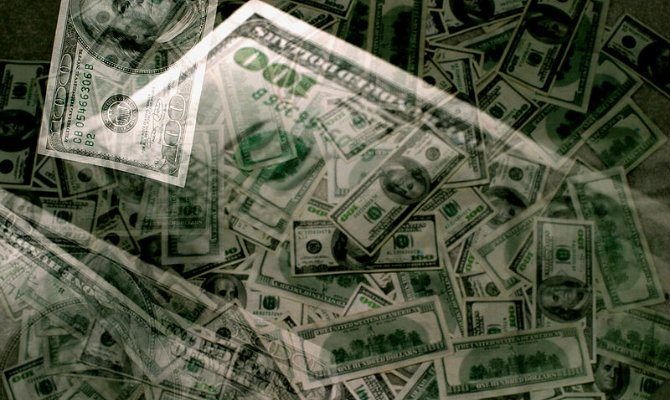 Pile of hundred dollar bills tip